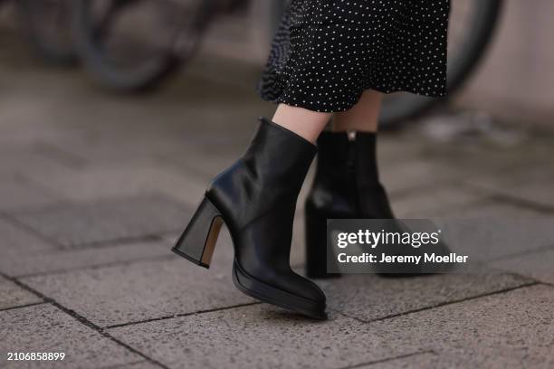 Marlies Pia Pfeifhofer seen wearing Adoore black with white dotty print pattern v-neck midi long dress and Souliers Martinez black leather heeled...