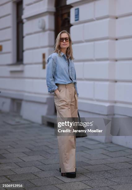 Marlies Pia Pfeifhofer seen wearing Vehla Eyewear brown sunglasses, gold necklace, Citizen of Humanity light blue denim blouse / buttoned shirt,...