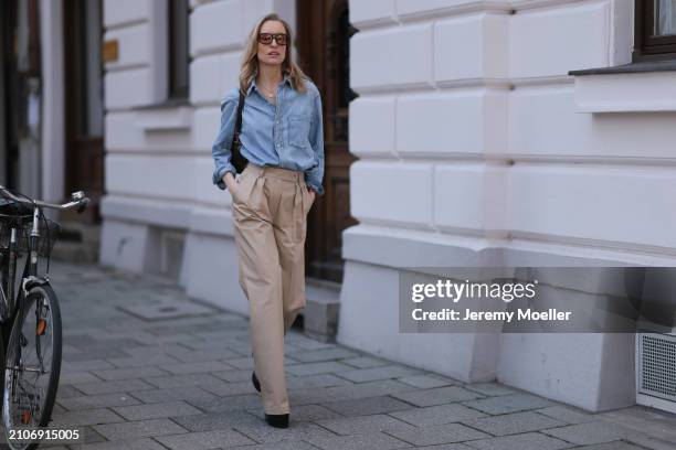 Marlies Pia Pfeifhofer seen wearing Vehla Eyewear brown sunglasses, gold necklace, Citizen of Humanity light blue denim blouse / buttoned shirt,...