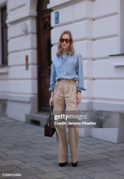 Marlies Pia Pfeifhofer seen wearing Vehla Eyewear brown sunglasses, gold necklace, Citizen of Humanity light blue denim blouse / buttoned shirt,...