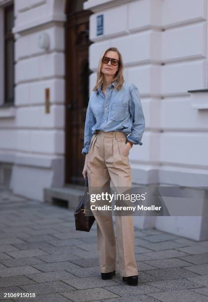 Marlies Pia Pfeifhofer seen wearing Vehla Eyewear brown sunglasses, gold necklace, Citizen of Humanity light blue denim blouse / buttoned shirt,...