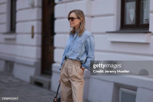 Marlies Pia Pfeifhofer seen wearing Vehla Eyewear brown sunglasses, Citizen of Humanity light blue denim blouse / buttoned shirt, Andiata beige wide...