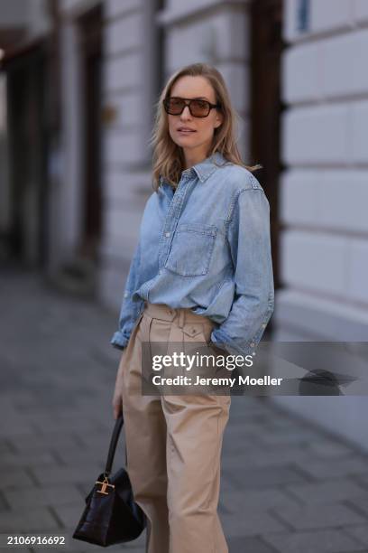 Marlies Pia Pfeifhofer seen wearing Vehla Eyewear brown sunglasses, Citizen of Humanity light blue denim blouse / buttoned shirt, Andiata beige wide...