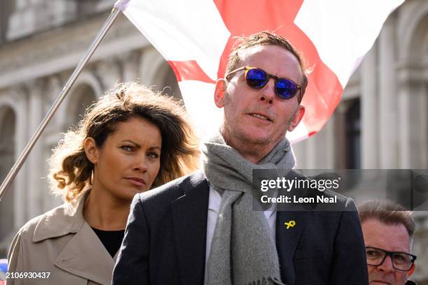 Political activist Laurence Fox stands with his partner Elizabeth Barker as he prepares to speak at a Right-wing "Rally for British Culture" near to...