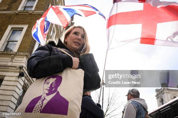 Lois Perry, a UKIP Leadership candidate, holds a bag with an image of Nigel Farage ahead a Right-wing "Rally for British Culture" near to The...