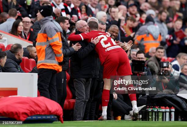 Gregory Vignal celebrates scoring his team's first goal with Sven-Goran Eriksson, Manager of Liverpool Legends, during the LFC Foundation charity...