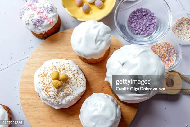 decorating easter cakes in a process - easter fruitcake stock pictures, royalty-free photos & images