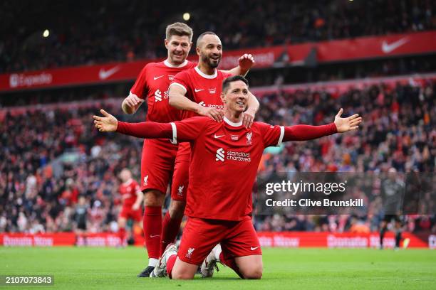 Fernando Torres of Liverpool Legends celebrates scoring his team's fourth goal with Steven Gerrard and Nabil El Zhar during the LFC Foundation...