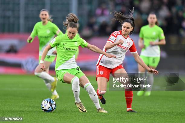 Ewa Pajor of VfL Wolfsburg competes for the ball with Sarah Zadrazil of FC Bayern München during the Google Pixel Women's Bundesliga match between...