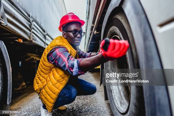 truck driver controlling vehicle before transportation service - entourage stock pictures, royalty-free photos & images