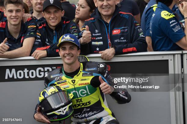 Oscar Gutierrez of Spain and Axxis-MSI celebrates the third place with team under the podium at the end of the MotoE race 2 during the MotoGP Of...