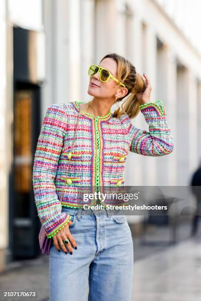 Tamara von Nayhauss, wearing a Boucle jacket with neon applications by Maison common, neon yellow sunglasses by Les Specs, a rose colored bag by...