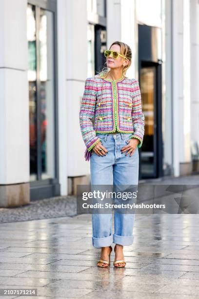 Tamara von Nayhauss, wearing a Boucle jacket with neon applications by Maison common, neon yellow sunglasses by Les Specs, a rose colored bag by...