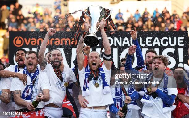 Jamie Grimes of Chesterfield lifts the Vanarama National League Trophy following victory in the Vanarama National League match between Chesterfield...