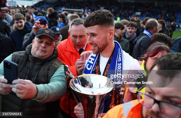 Ryan Colclough of Chesterfield poses for photos with fans and the Vanarama National League Trophy following the Vanarama National League match...