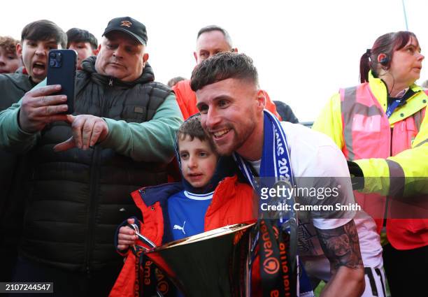 Ryan Colclough of Chesterfield poses for photos with fans and the Vanarama National League Trophy following the Vanarama National League match...