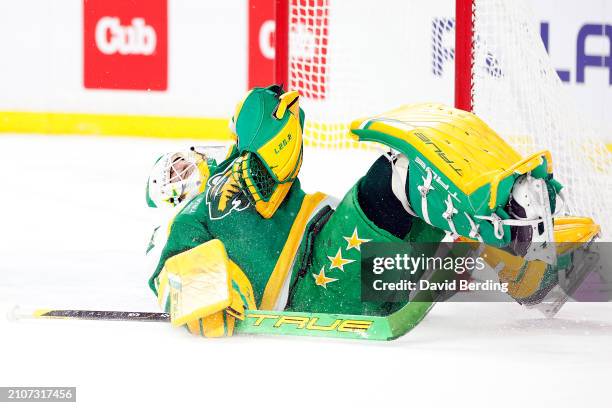 Marc-Andre Fleury of the Minnesota Wild reacts to making a save against the St. Louis Blues in the first period at Xcel Energy Center on March 23,...