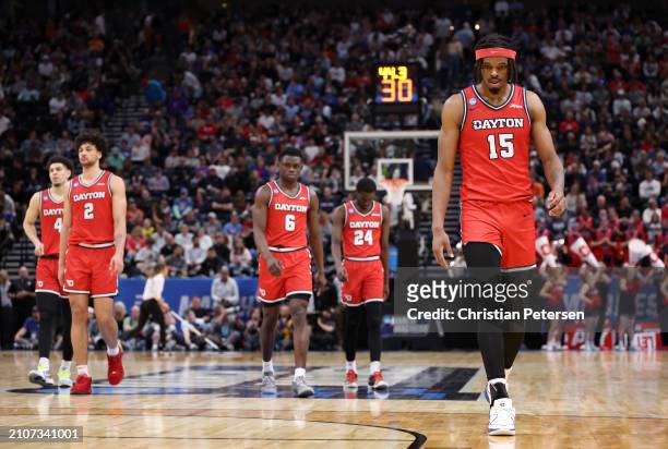 Koby Brea, Nate Santos, Enoch Cheeks, Kobe Elvis, and DaRon Holmes II of the Dayton Flyers react as time expires during the second half against the...