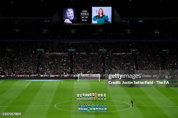 Players and fans of England and Brazil applaud during a tribute to former England player and manager Terry Venables prior to the international...