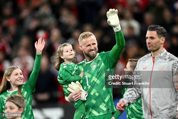 Kasper Schmeichel of Denmark walks out for his 100th cap for Denmark with family prior to the international friendly match between Denmark and...