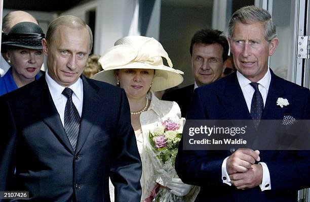 Russian President Vladimir Putin and his wife Ludmila are greeted by the Prince of Wales as he arrives in Britain at Heathrow airport for a four-day...