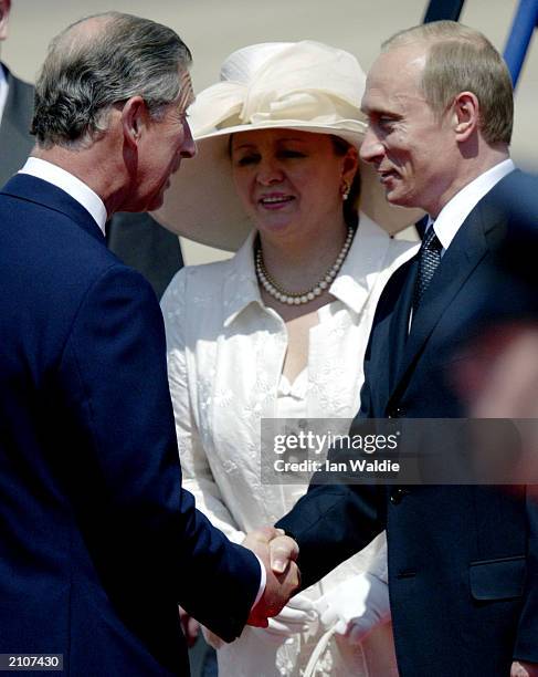 Russian President Vladimir Putin and his wife Ludmila are greeted by the Prince of Wales as he arrives in Britain at Heathrow airport for a four-day...