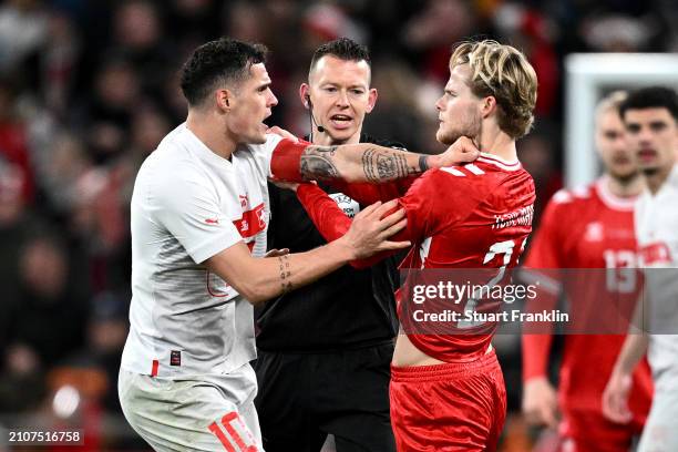 Granit Xhaka of Switzerland clashes with Morten Hjulmand of Denmark during the international friendly match between Denmark and Switzerland at Parken...