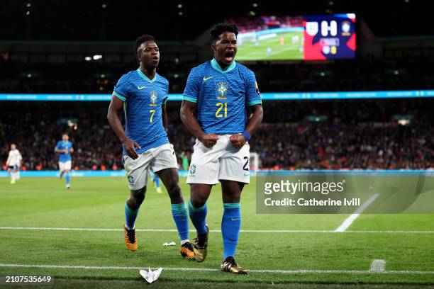Endrick of Brazil celebrates scoring his team's first goal alongside Vinicius Junior during the international friendly match between England and...
