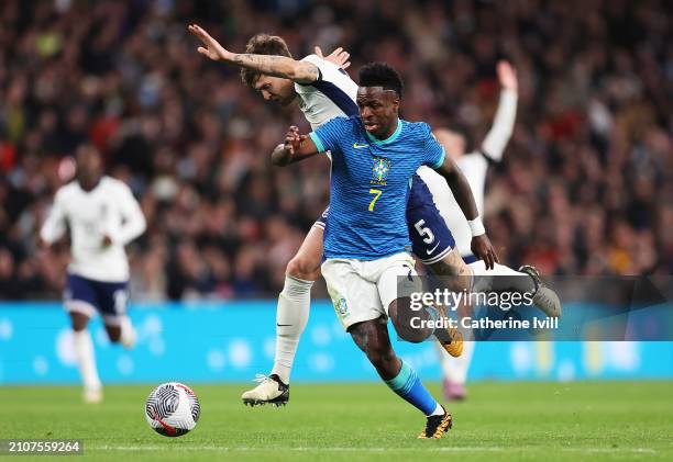 Vinicius Junior of Brazil is challenged by John Stones of England during the international friendly match between England and Brazil at Wembley...