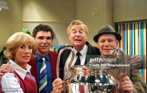 Actors Joke Bruijs, Sjoerd Pleijsier and Gerard Cox with guest former Dutch Feyenoord football player Willem van Hanegem on the set of the Dutch TV...