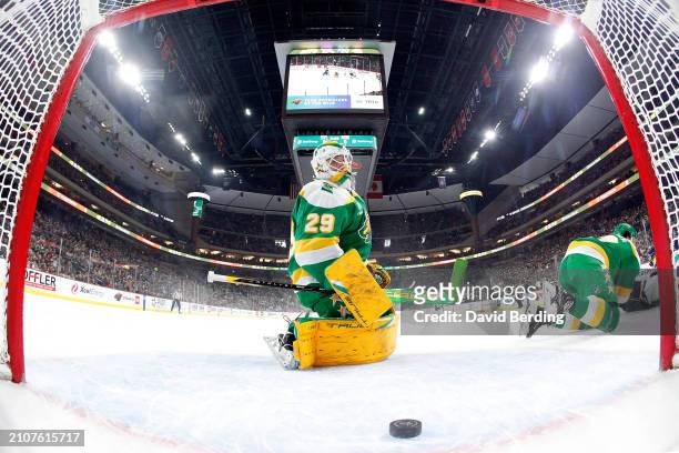 Marc-Andre Fleury of the Minnesota Wild reacts to giving up a goal to Jake Neighbours of the St. Louis Blues in the first period at Xcel Energy...