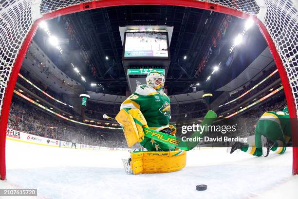 Marc-Andre Fleury of the Minnesota Wild reacts to giving up a goal to Jake Neighbours of the St. Louis Blues in the first period at Xcel Energy...