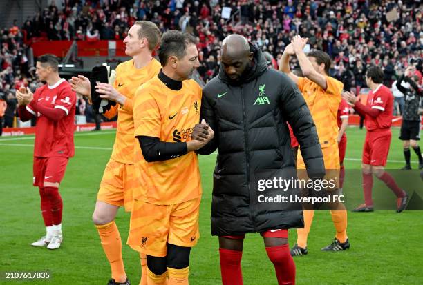 Jerzy Dudek and Mohamed Sissoko of Liverpool during the LFC Foundation charity match between Liverpool FC Legends and AFC Ajax Legends at Anfield on...