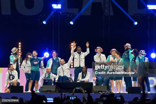 Volunteers are showing the Paris 2024 volunteers outfit during the Paris 2024 Olympic and Paralympic volunteers convention at Paris La Defense Arena...