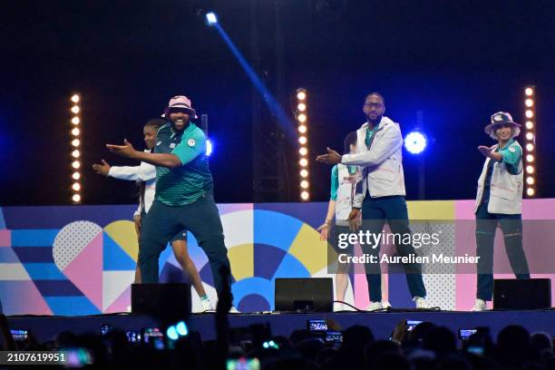 Volunteers are showing the Paris 2024 volunteers outfit during the Paris 2024 Olympic and Paralympic volunteers convention at Paris La Defense Arena...