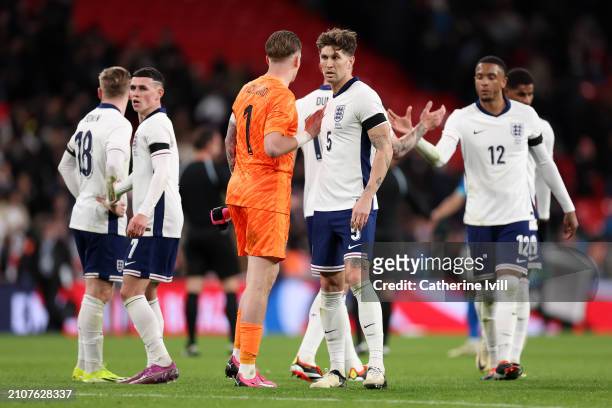 Jordan Pickford and John Stones of England look dejected after the team's defeat during the international friendly match between England and Brazil...