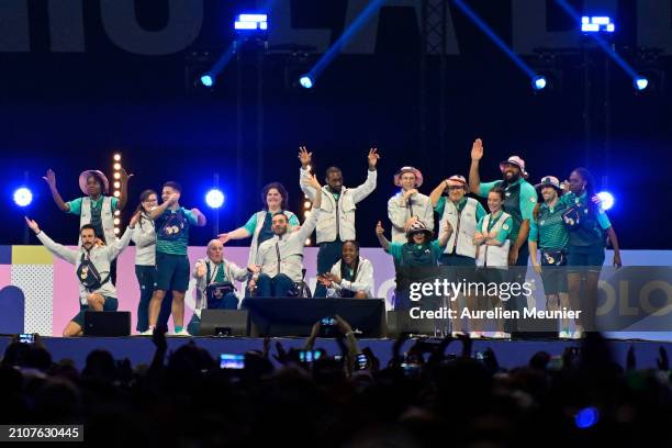 Volunteers are showing the Paris 2024 volunteers outfit during the Paris 2024 Olympic and Paralympic volunteers convention at Paris La Defense Arena...