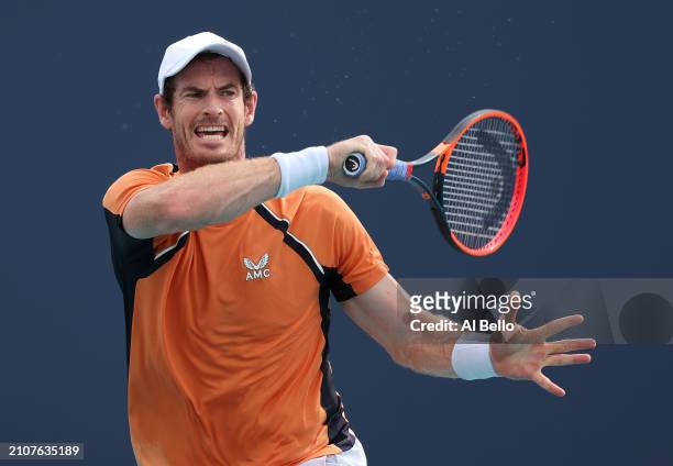 Andy Murray of Great Britain returns a shot against Tomas Martin Etcheverry of Argentina during their match on day 8 of the Miami Open at Hard Rock...