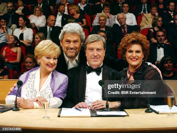 Presenter Ernst Daniel Smid is seen with jury members Wilma Driessen, Ruud van der Meer and Marjolein Touw during an episode of the Dutch TROS TV...