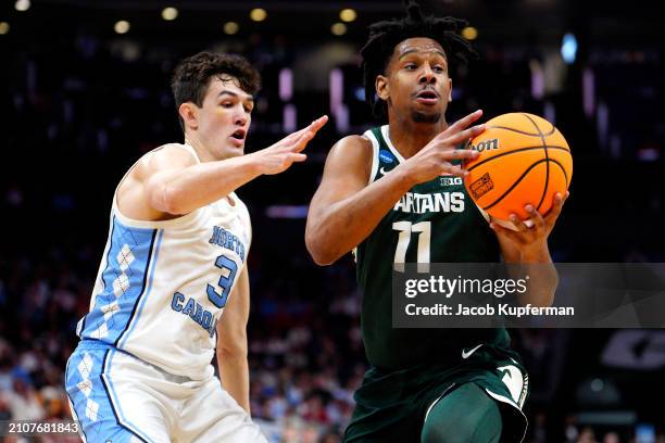 Hoggard of the Michigan State Spartans handles the ball against Cormac Ryan of the North Carolina Tar Heels during the first half in the second round...