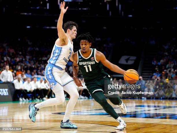 Hoggard of the Michigan State Spartans drives to the basket against Cormac Ryan of the North Carolina Tar Heels during the first half in the second...