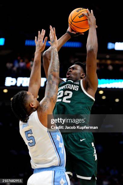 Mady Sissoko of the Michigan State Spartans shoots the ball against Armando Bacot of the North Carolina Tar Heels during the first half in the second...