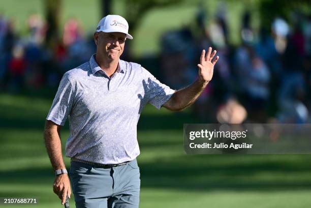 Stewart Cink of the United States waves on the 18th hole during the third round of the Valspar Championship at Copperhead Course at Innisbrook Resort...