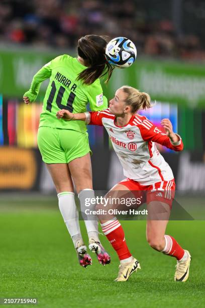 Nuria Rabano Blanco of VfL Wolfsburg competes for the ball with Lea Schueller of FC Bayern München during the Google Pixel Women's Bundesliga match...