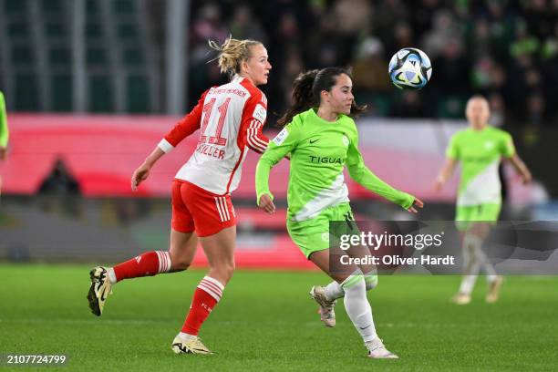 Nuria Rabano Blanco of VfL Wolfsburg competes for the ball with Lea Schueller of FC Bayern München during the Google Pixel Women's Bundesliga match...