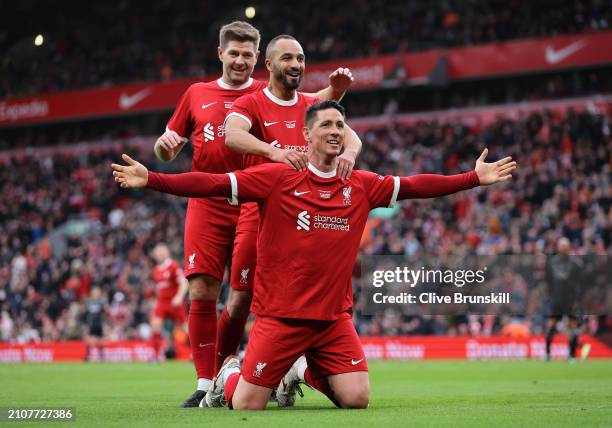 Fernando Torres of Liverpool Legends celebrates scoring his team's fourth goal with team mates Steven Gerrard and Nabil El Zhar during the LFC...