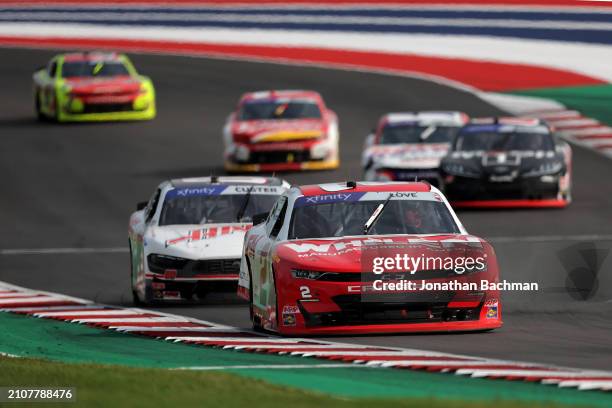 Jesse Love, driver of the Whelen Chevrolet, and Cole Custer, driver of the Haas Automation Ford, race during the NASCAR Xfinity Series Focused Health...