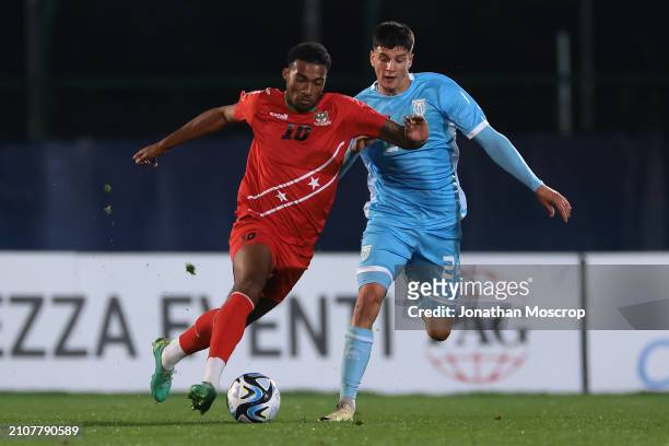 Tyrese Shade of St. Kitts and Nevis takes on Andrea Contadini of San Marino during the International Friendly match between San Marino and St. Kitts...