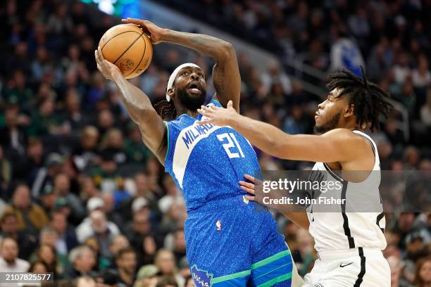 Patrick Beverley of the Milwaukee Bucks goes up for a shot on Cam Thomas of the Brooklyn Nets during the first half of the game at Fiserv Forum on...