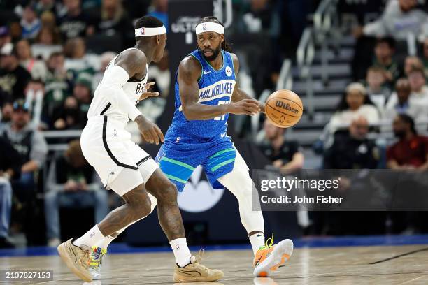Patrick Beverley of the Milwaukee Bucks dribbles up court during the first half of the game against the Brooklyn Nets at Fiserv Forum on March 21,...